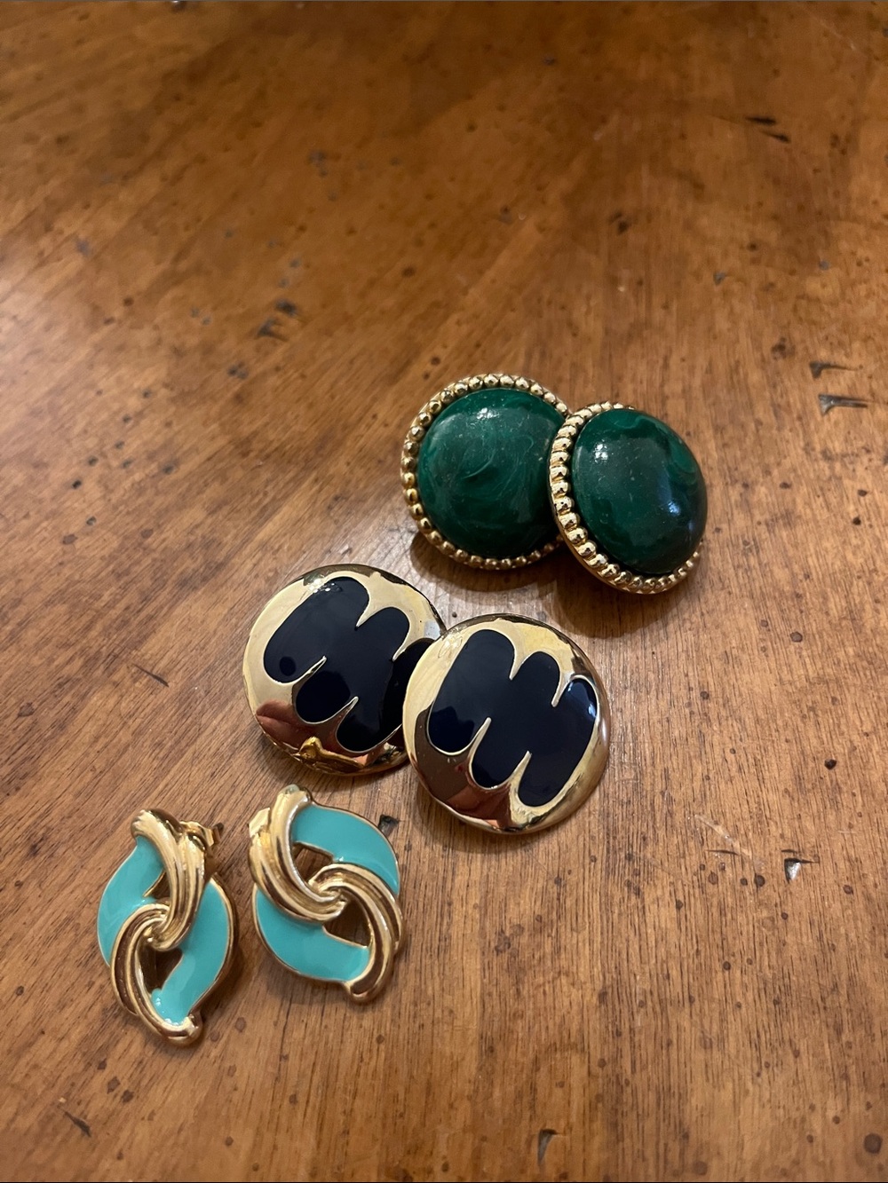 Three pairs of large statement earrings